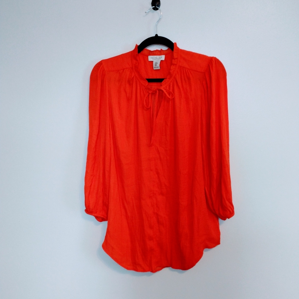 Rachel Zoe orange red blouse with high neckline and tie at the collar. Size medi